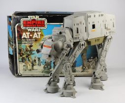 A Star Wars AT-AT All Terrain Armoured transport vehicle, No 33354, boxed and a Star Wars Action