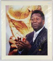 Pele Football signed print - in suit with World Cup trophy, signed in black pen, 69x60 cm,