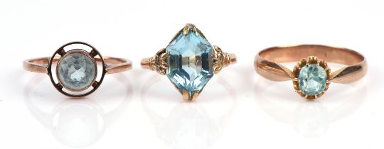 Three blue paste rings, two with round cut stones in 9 ct, sizes R and O, the other with a fancy