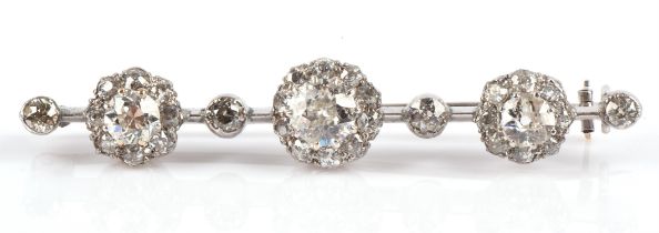 Diamond bar brooch set with old cut diamonds in unmarked white metal testing as 9 ct gold,