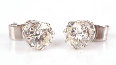 Single stone round brilliant cut diamond stud earrings in unmarked white metal tested as 18 ct