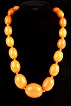 1920's graduated oval amber beads, strung with knots, with a gold plated bolt ring clasp,