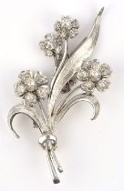 Floral diamond set brooch, with old cut diamonds, in 9 ct, with safety chain, measuring 56mm x 32mm