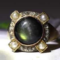 Chrysoberyl dress ring, cats eye chrysoberyl cabochon surrounded by rose cut diamonds and pearls,