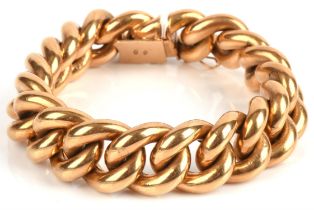 A heavy curb link bracelet, 17mm wide, with a concealed box clasp with Italian marks for 18 ct,