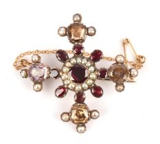 A Georgian brooch consisting of foil-backed garnets, amethysts and citrines, with seed pearls,