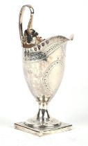 George III helmet shaped cream jug with crimped rim and bright cut decoration by Hester Bateman.