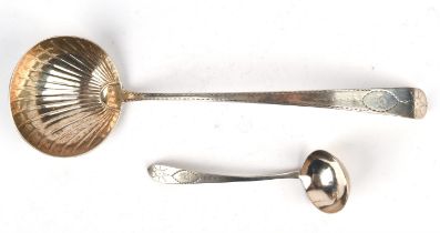 George III Irish shell bowl silver ladle with bright cut decoration and Boars Head crest,