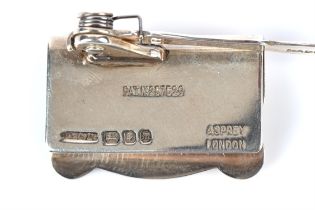 Asprey's Patent silver bookmark / page holder, London 1967, engine turned cigar piercer,