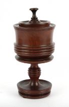 A George III style turned lignum vitae lidded goblet, ring turned and on a dished base, H 25cm