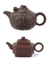 Two Yixing unglazed teapots from the Jiangsu Province tradtion; the larger about 17 cm long and