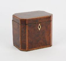 An early 19th century yew wood tea caddy of canted rectangular form with kingwood cross banded