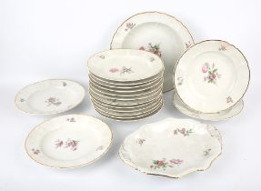 Sixteen KPM porcelain dinner plates, decorated with floral sprays with gilt lining to rim,