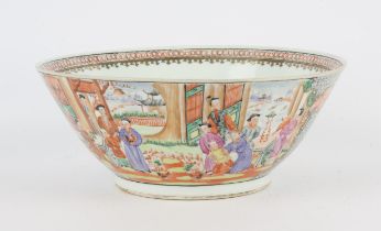 A famille rose style punch bowl, decorated with panels of Manchu/Chinese figures in gardens and
