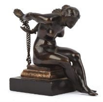 Early 19th century Grand Tour bronze of a seated female, her hands chained behind her,