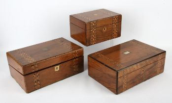 Two Victorian walnut and geometrically banded writing slopes, together with a Victorian walnut