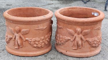 Pair of garden terracotta circular planters with classical decoration in relief of a winged