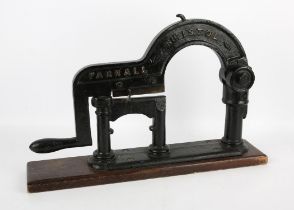 A Late 19th century cast iron Improved patent tobacco cutter on wooden base by Parnall-Bristol ,