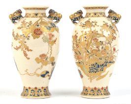 A pair of small Satsuma tapering oviform vases; each with karashishi handles; decorated in gosu