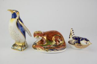 Royal Crown Derby, Otter with gold stopper, boxed, Emperor Penguin with gold stopper,