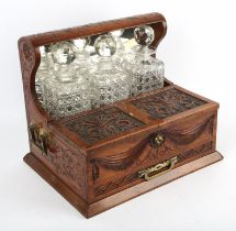 Edwardian mahogany carved tantalus games compendium, with Bramah lock to storage containers