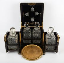 Coromandel and brass bound decanter box, 19th Century, with a lifting lid holding four glasses,