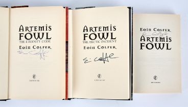 EOIN (Colfer). Signed first editions of the author's first three novels in the Artemis Fowl series.