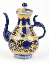 A Chinese underglaze blue and imperial yellow ewer with domed cover and knop finial; the base with