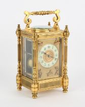 French brass carriage clock, 20th Century, with reel form handle, the case with fluted pillars and