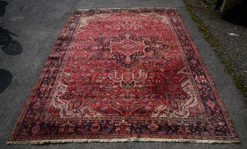 Persian wool carpet, early/mid 20th Century, with a large petalled lotus floral lozenge,