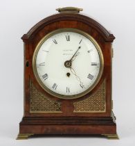 A late 19th century mahogany cased bracket clock. The white enamelled dial detailed NEWTON BURNLEY