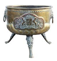 Brass log bin, late 19th Century, embossed with coats of arms between lions mask ring handles,
