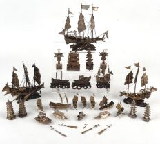 A Collection of 25 Chinese white metal models of river craft/sailing vessels and other objects,