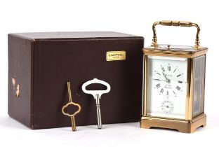 Brass carriage clock by L' Epee, with polished brass case, the white enamel dial with Roman and