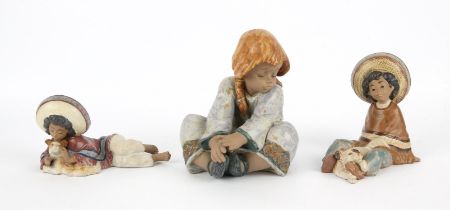 A Lladro matt glazed figure 'Lazy Day' model number 2210 and two further Lladro matt glaze figures