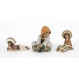 A Lladro matt glazed figure 'Lazy Day' model number 2210 and two further Lladro matt glaze figures