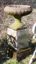 Reconstituted stone tazza or bird bath, on a stepped plinth, 32cm high x 40cm diameter