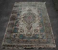 Part silk rug, 20th Century, central shaped medallion with pistachio ground, on ivory field with