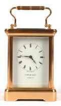 20th century brass four glass carriage clock, the dial bearing Roman numerals, marked for Garrard &