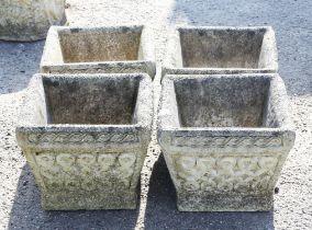 Four square tapering planters, with scrolling edge above Celtic knot type panels,