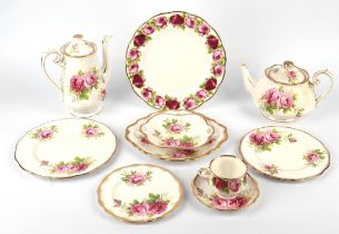 A Royal Albert bone china part tea and dinner service, the American Beauty pattern,