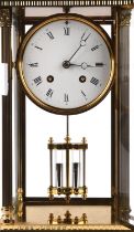 A Victorian style brass mantel clock, the 4 inch white enamel dial with Roman numerals,