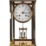 A Victorian style brass mantel clock, the 4 inch white enamel dial with Roman numerals,