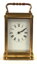 Late 19th / early 20th century brass and glass carriage clock striking on a coiled gong