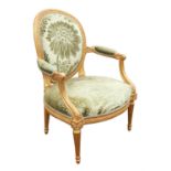 George III style giltwood armchair, 19th century, re-gilt, with open padded arms and tapered fluted