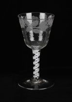 A George III wine glass, with internally decorated spiral stem, engraved with flowerheads and