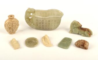 A group of jades or hardstones, including: a libation cup with animal handle and inscription, 12.