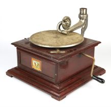 Leophone record player, with a brass horn and a collection of gramophone records