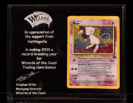 Pokemon TCG. Wizards of the Coast Commemorative acrylic piece with a holographic Black Star Mew