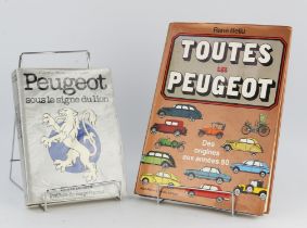 Two Peugeot books: Toutes Les Peugeot (French text) by Rene Bellu. And Peugeot sous le signe du